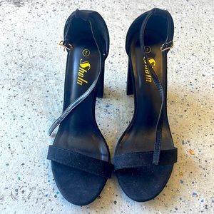 Black high heel peep toe shoe. Size 7